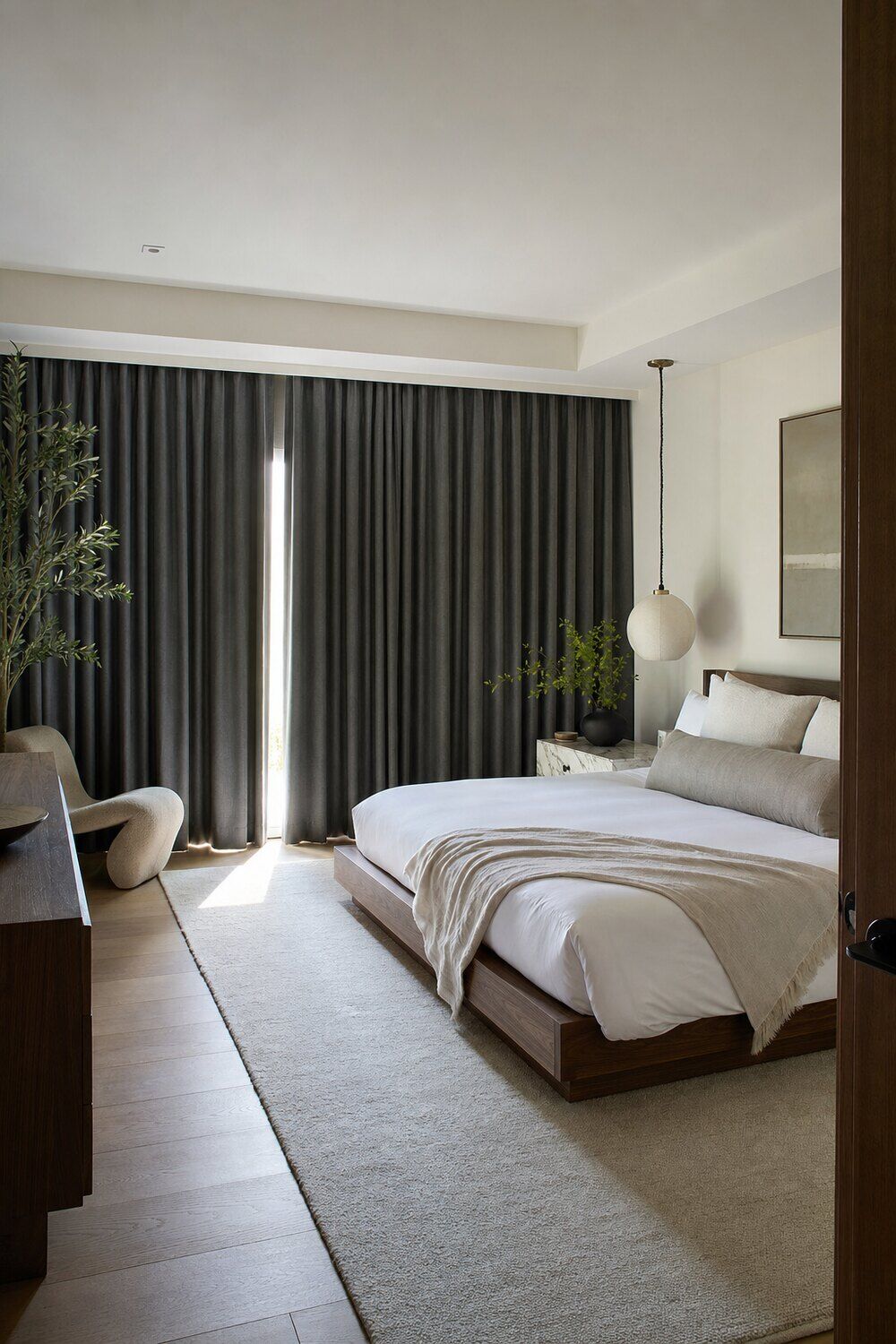 Full-length drapery panels framing a window in a calm room