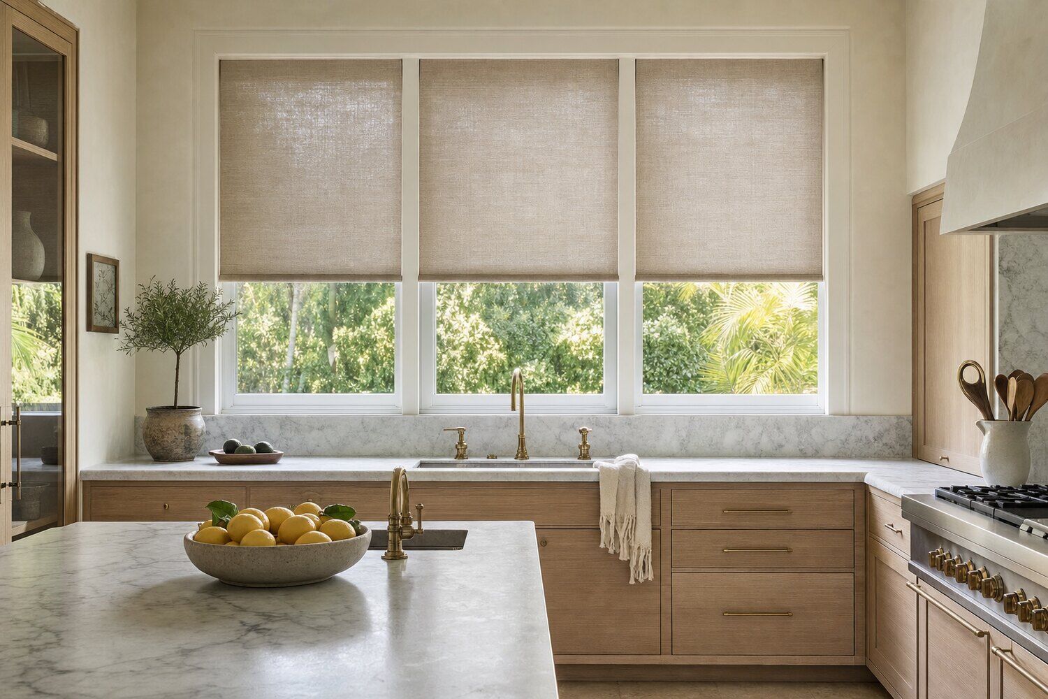 Motorized shades across a window wall in a sunlit room