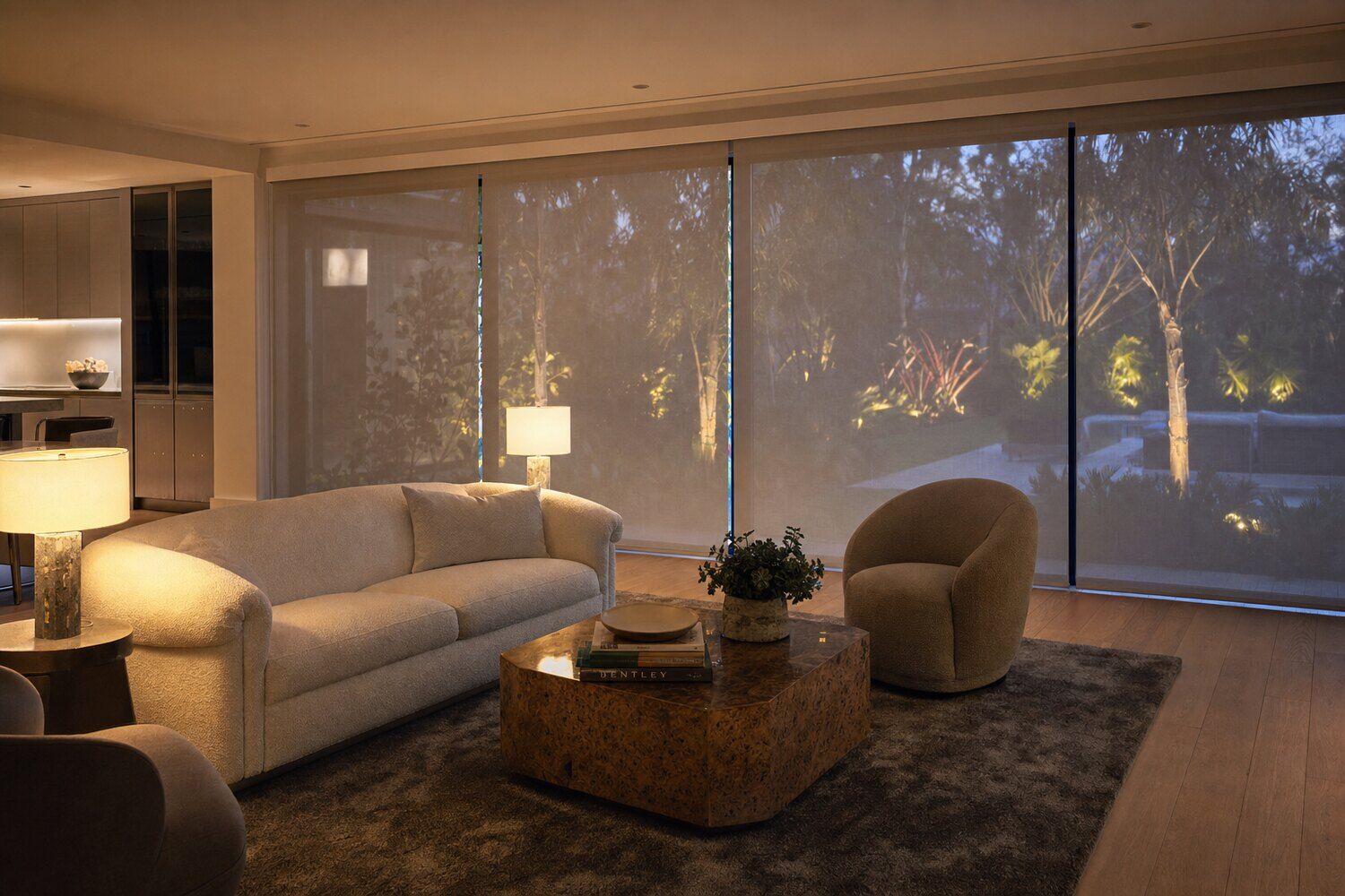 Motorized shades across a window wall in a south-facing room