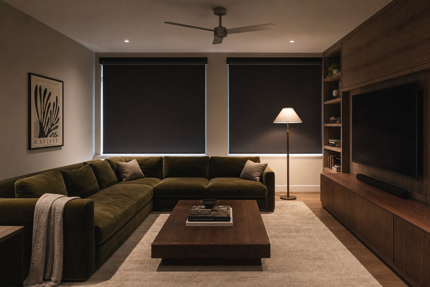 A south-facing room with fabric shades lowered against the light