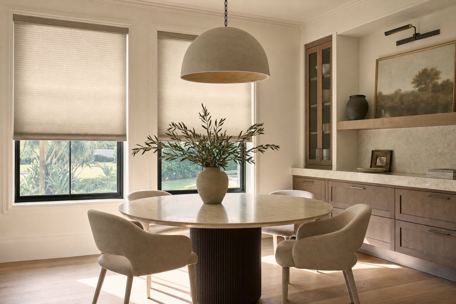 A paneled room with fabric shades lowered against the light