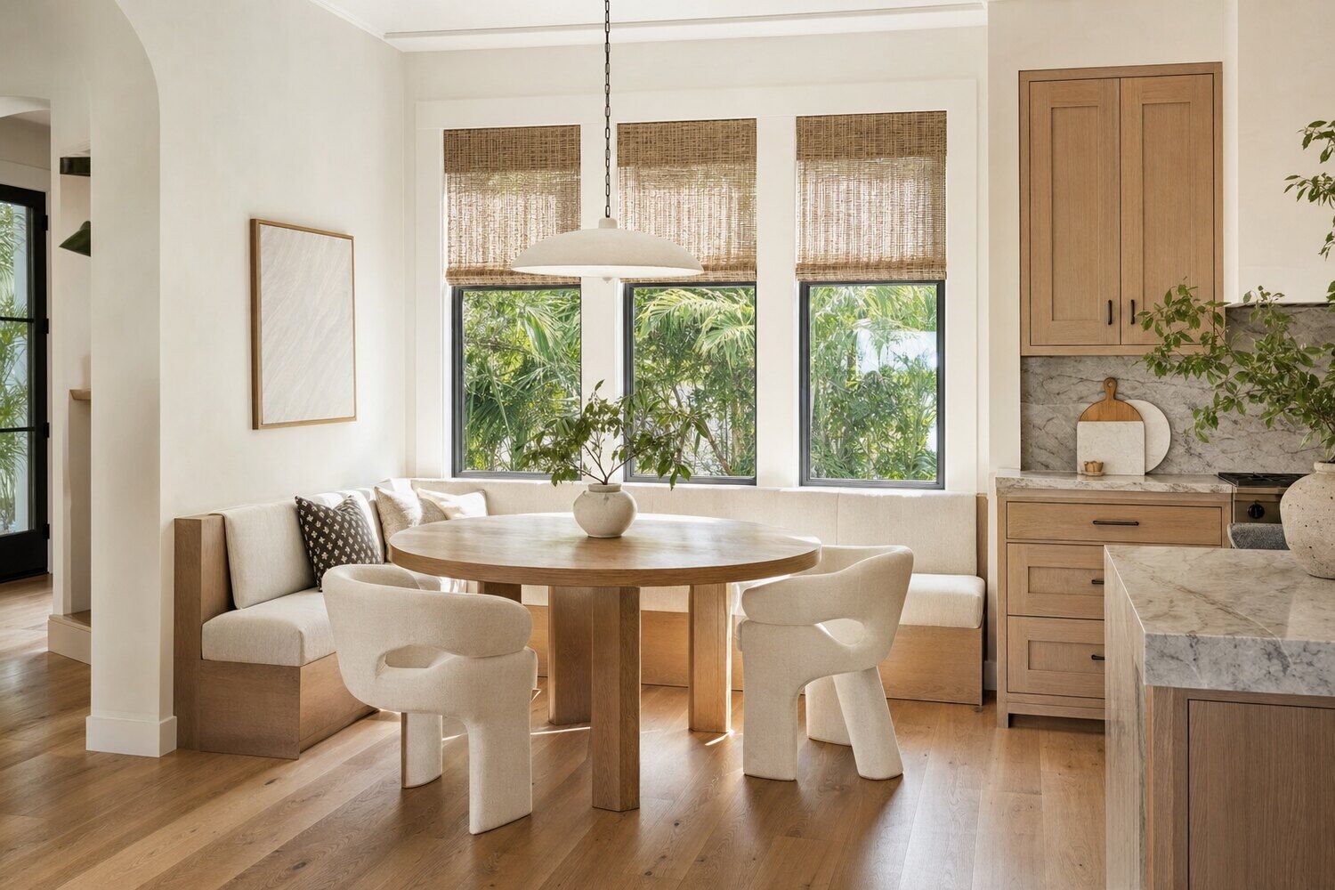 A south-facing room with fabric shades lowered against the light
