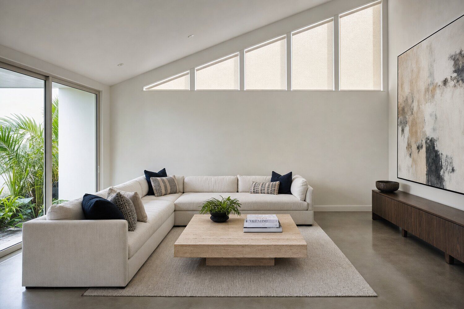 An unusually shaped window treated to follow its outline in a double-height room