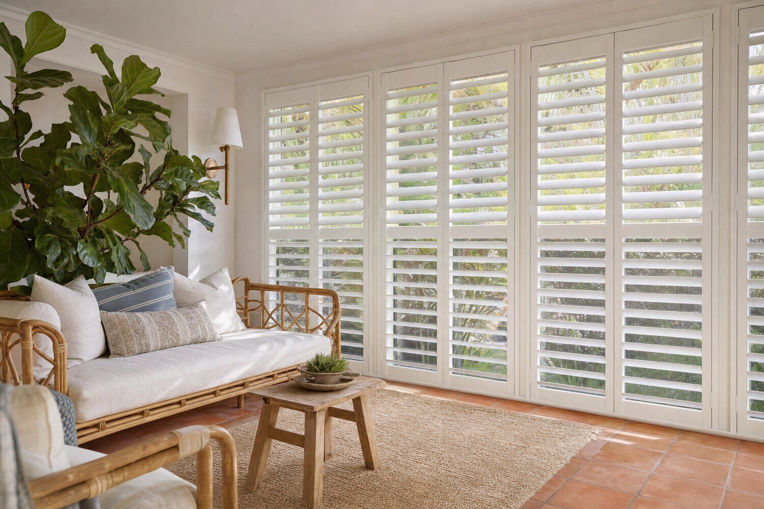 Interior shutters with the louvers angled in a paneled room