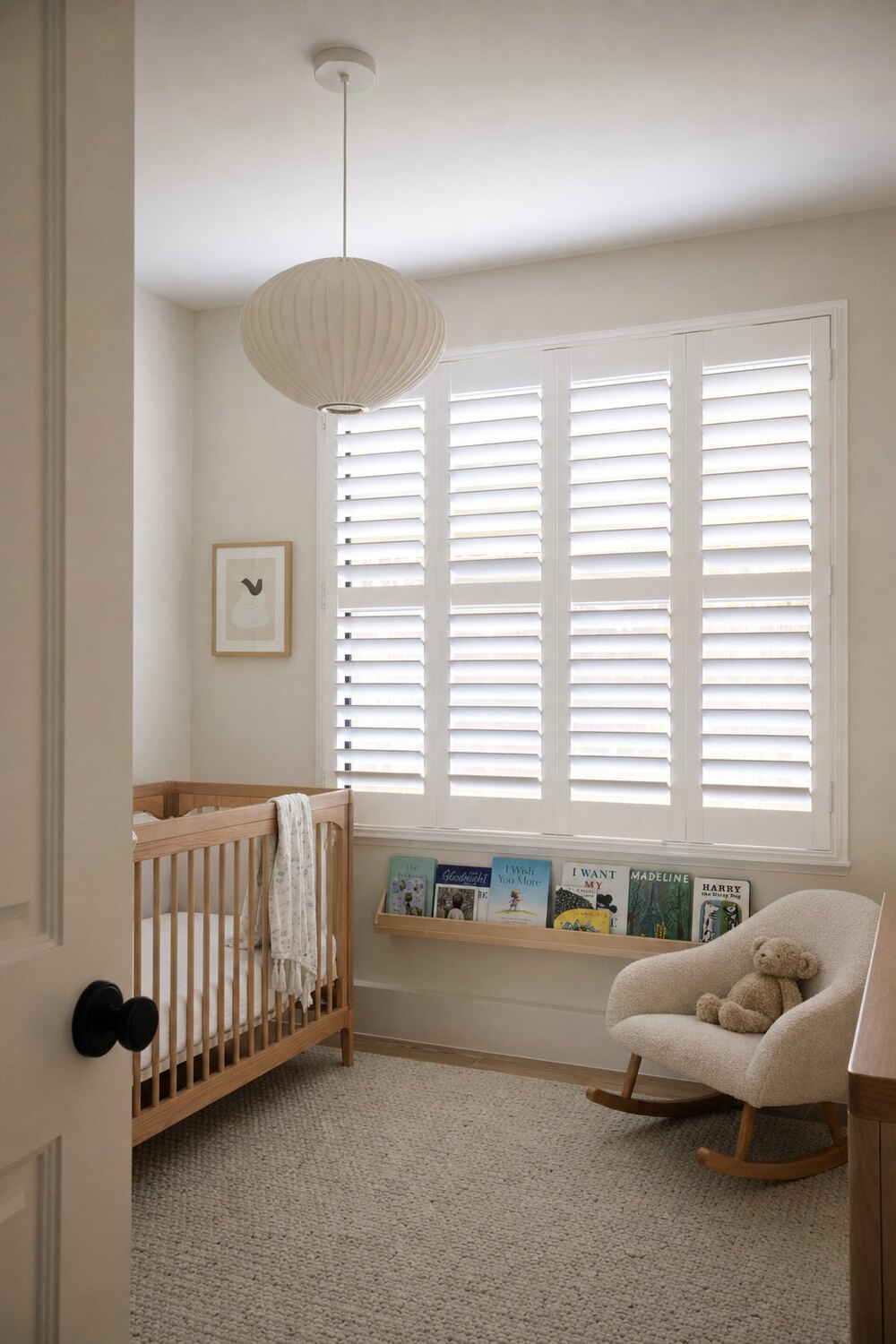 Interior shutters with the louvers angled in a sunlit room
